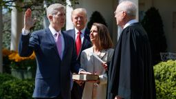 President Donald Trump watches as Supreme Court Justice Anthony Kennedy administers the judicial oath to Judge Neil Gorsuch during a re-enactment in the Rose Garden of the White House, Monday, April 10, 2017, in Washington. Gorsuch's wife Marie Louise hold a bible at center. (AP Photo/Evan Vucci)