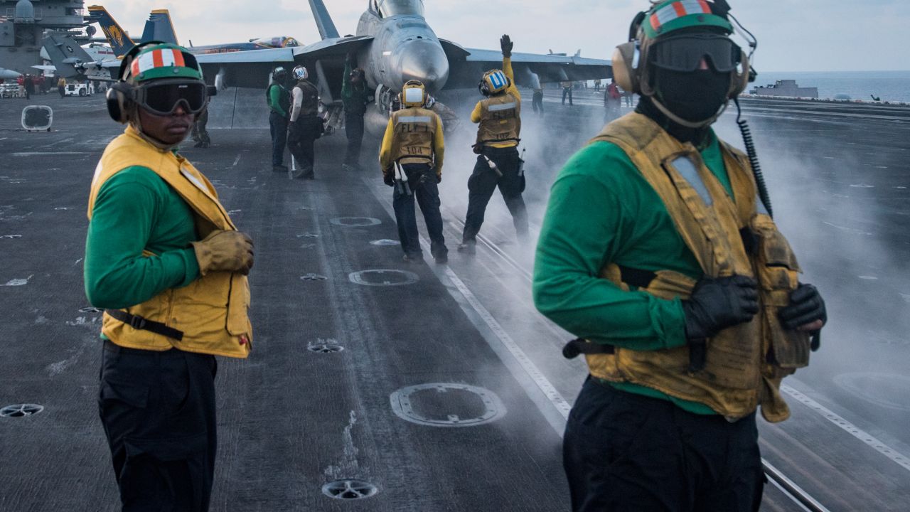 170408-N-HD638-245 
SOUTH CHINA SEA (April 8, 2017) Sailors conduct flight operations on the aircraft carrier USS Carl Vinson (CVN 70) flight deck. The Carl Vinson Carrier Strike Group is on a regularly scheduled Western Pacific deployment as part of the U.S. Pacific Fleet-led initiative to extend the command and control functions of U.S. 3rd Fleet. U.S Navy aircraft carrier strike groups have patrolled the Indo-Asia-Pacific regularly and routinely for more than 70 years. (U.S. Navy photo by Mass Communication Specialist 3rd Class Matt Brown/Released)