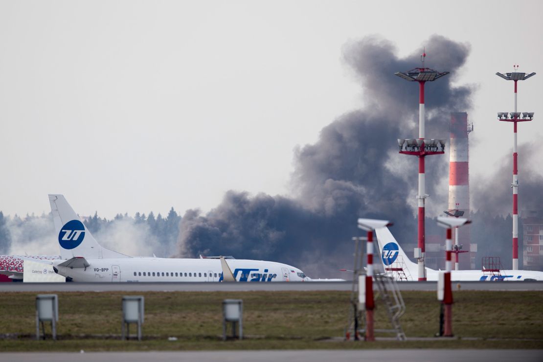 Smoke rises behind a runway just before US Secretary of State Rex Tillerson arrival in Moscow's Vnukovo airport.