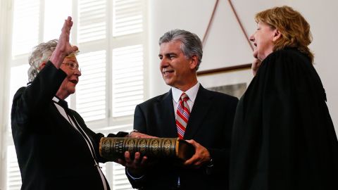 Kay Ivey, left, takes the oath of office to be governor of Alabama as she is sworn in by acting Chief Justice Lyn Stuart on April 10, 2017, in Montgomery, Alabama.