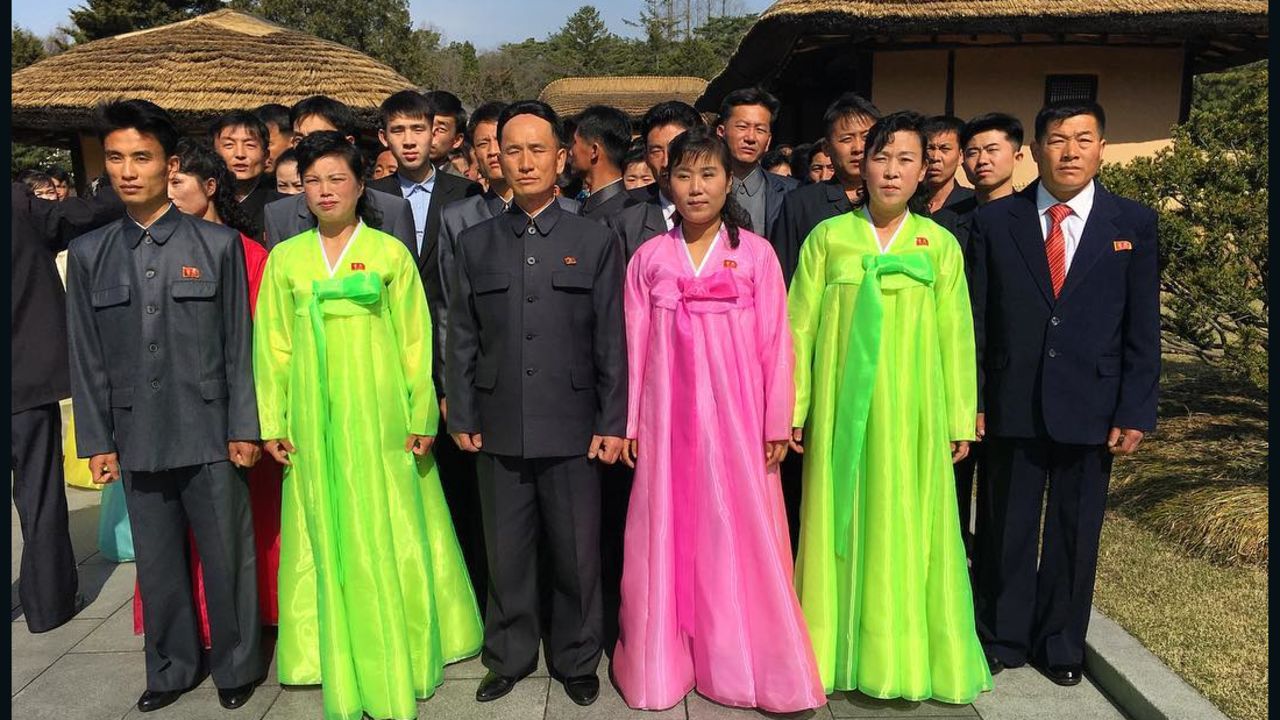North Koreans pose for a photograph at Mangyongdae, which is the birthplace of their late founder Kim Il Sung.