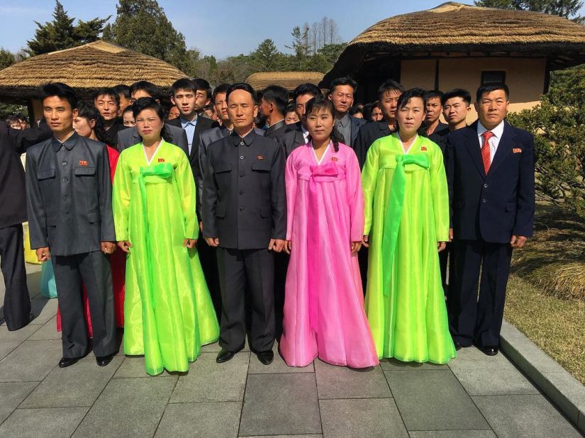 North Koreans pose on April 9, for a photo at Mangyongdae, the birthplace of Kim Il Sung.