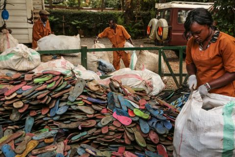 "Over three billion people can only afford that type of shoe," says Erin Smith of Ocean Sole, a Kenyan conservation group and recycling collective, above pictured as they collect flip flops.