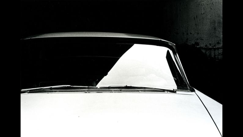 A shadow splits a car windshield in Philadelphia.