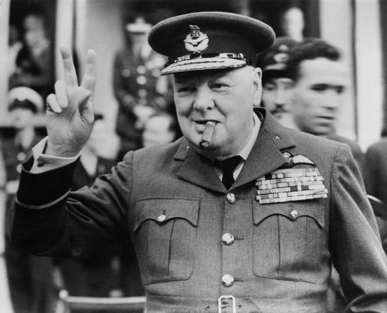 Winston Churchill flashing his famous "V for victory" sign in Croydon, England in 1948. 