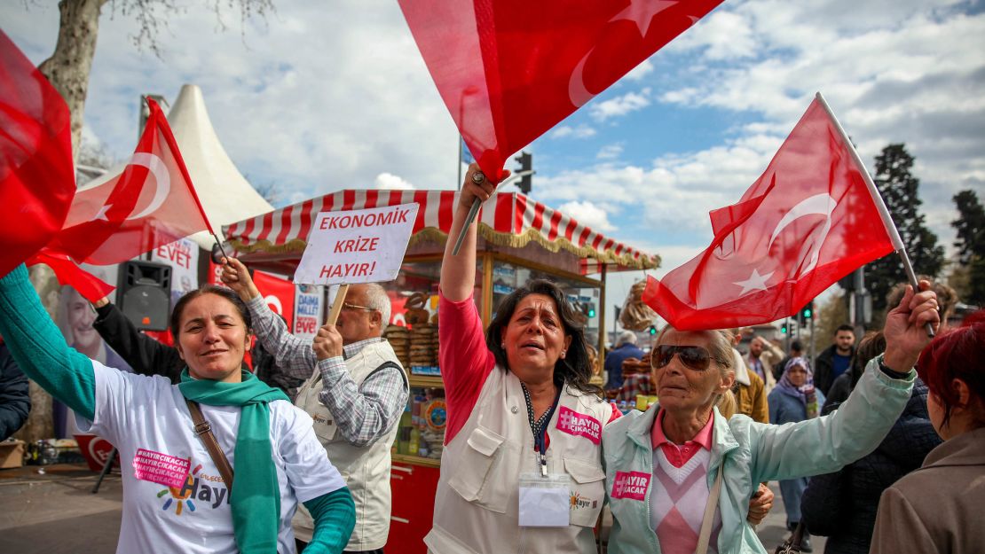 Supporters from the opposition party Republican People's Party (CHP) wave the Turkish flag and sing their official "No" referendum song at party tent in the middle of Istanbul on Sunday, April 9, 2017. 