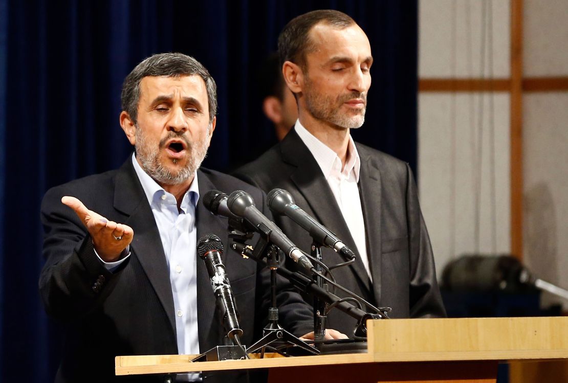 Ahmadinejad (left) speaks,  accompanied by former Iranian Vice President Hamid Baghaei, after registering at the Interior Ministry's election headquarters.