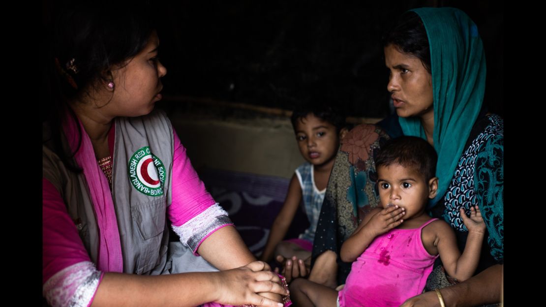 Rabeya, 25, talking with the Bangladesh Red Crescent volunteer trained in psychosocial support in the makeshift Balukhali camp in Ukhiya, Cox's Bazar district, south eastern Bangladesh on 8 April, 2017.