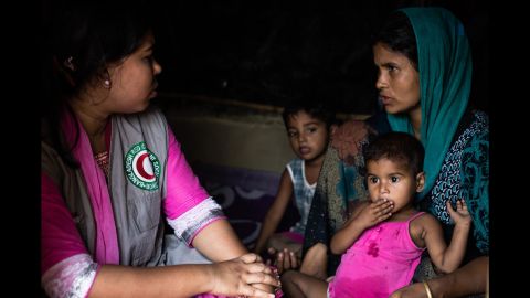 Rabeya, 25, talking with the Bangladesh Red Crescent volunteer trained in psychosocial support in the makeshift Balukhali camp in Ukhiya, Cox's Bazar district, south eastern Bangladesh on 8 April, 2017.
