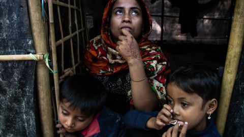 Mohsena, 22, is seen in front of her shelter with her two children.