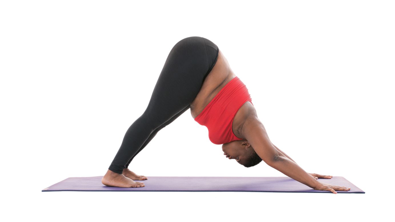 <strong>Downward-facing dog: Adho Mukha Svanasana</strong> One of the poses most widely associated with yoga, downward-facing dog can also be done with modifications for comfort including adding two blocks under your hands. In the unmodified version, Stanley says, "Keep a bend in your knees if necessary. Keep shooting your hips up and back. Distribute your weight evenly though your entire hand, including the fingertips."<br /> 