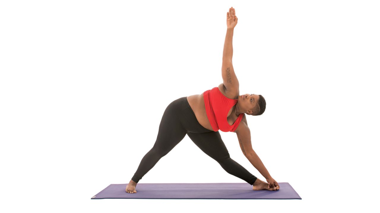 <strong>Extended triangle: Utthita Trikonasana</strong> This pose can also be modified with a block under the hand closest to the floor if you cannot reach all the way to the ground. Stanley says, "Keep a microbend in your front knee" and suggests that you "look up or down depending on your mood." 