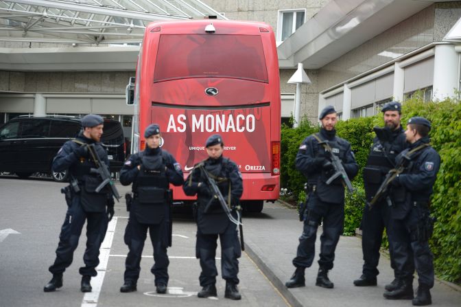 Policemen stood guard in front of a Monaco team bus Wednesday before the rescheduled Champions League encounter as security was tightened. <br />