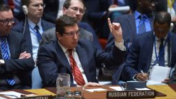 Russia's deputy UN ambassador, Vladimir Safronkov unsuccessfully tries to get US Ambassador to the UN and UN security council president, Nikki Haley's attention during a United Nations Security Council meeting on Syria, at the UN headquarters in New York on April 7, 2017. 