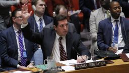 Russian Deputy Permanent Representative to the United Nations Vladimir Safronkov holds up his hand as he votes against a Draft resolution that condemns the reported use of chemical weapons in Syria at the Security Council on April 12, 2017 at UN Headquarters in New York. 
The United Nations peace envoy for Syria on Wednesday urged the United States and Russia to agree on a way forward to end the war in Syria and pave the way for a "real negotiation." Special envoy Staffan de Mistura told the UN Security Council that he was ready to convene a new round of talks in May but that US-Russian cooperation was needed.
 / AFP PHOTO / KENA BETANCUR        (Photo credit should read KENA BETANCUR/AFP/Getty Images)