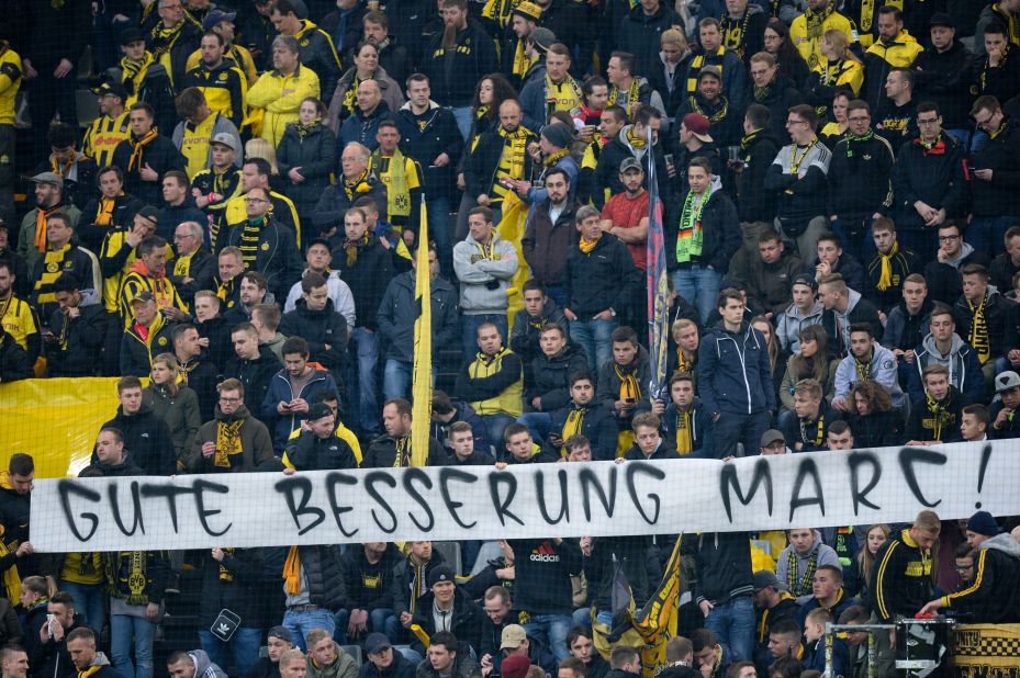 Dortmund fans displayed a banner with a message to their Spanish defender, who underwent surgery on his injured arm and hand, which read "Get well Marc."