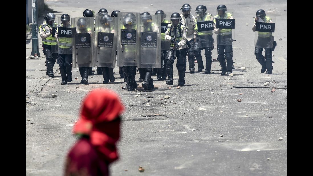 Venezuelan police line up before clashing with opposition activists on Thursday, April 6.