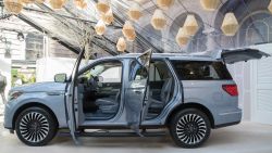 In this Tuesday, April 11, 2017, photo, the 2018 Lincoln Navigator is on display during a media preview in New York. Ford Motor Co.'s Lincoln luxury brand is making a play for a General Motors stronghold, revamping the Navigator truck-based SUV so it can better compete with the Cadillac Escalade and other big GM people haulers. (AP Photo/Mary Altaffer)