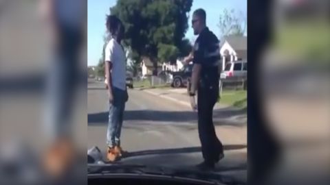 A cellphone video shows Cain and the officer arguing.