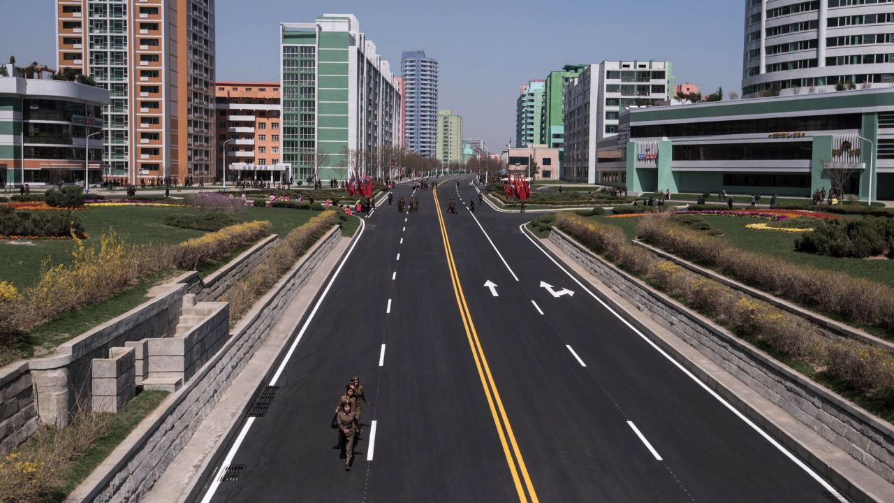 Soldiers leave the Ryomyong Street development following its official opening attended by Kim Jong Un.