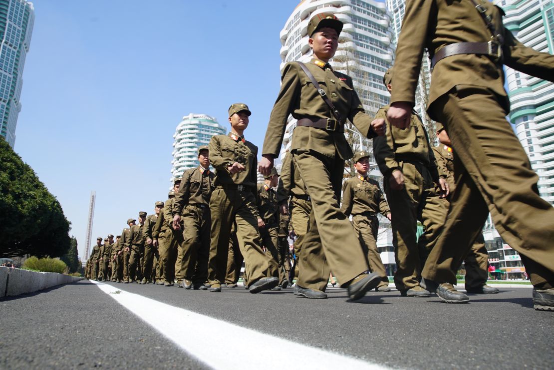 Soldiers march during the opening of Ryomyong Street.