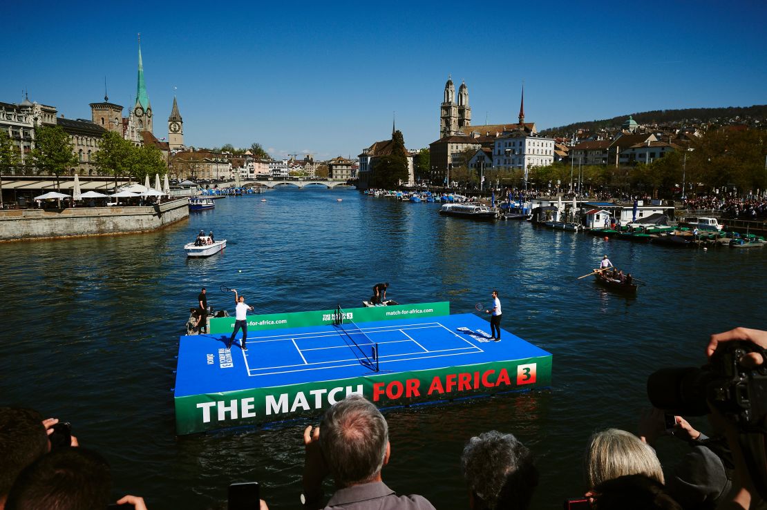 Roger Federer (L) plays world No.1 Andy Murray on a floating tennis court before the pair prepared to play each other in 'Match for Africa 3' to raise money for the Swiss' foundation. 