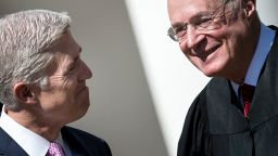 Neil Gorsuch (L) smiles at Supreme Court Justice Anthony Kennedy before taking the judicial oath during a ceremony in the Rose Garden of the White House April 10, 2017 in Washington, DC. / AFP PHOTO / Brendan Smialowski 