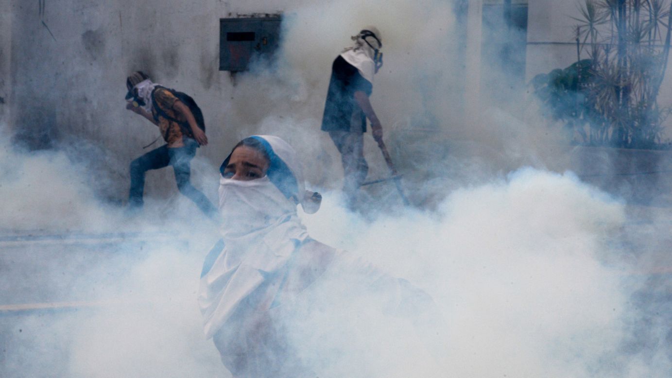 Tear gas engulfs people in Caracas, Venezuela, as they protest against the Venezuelan government on Monday, April 10. Last month, the Venezuelan Supreme Court <a href="http://www.cnn.com/2017/03/30/americas/venezuela-dissolves-national-assembly/" target="_blank">stripped the country's National Assembly of its powers.</a> The National Assembly, Venezuela's legislative body, has had an opposition majority since January 2016.