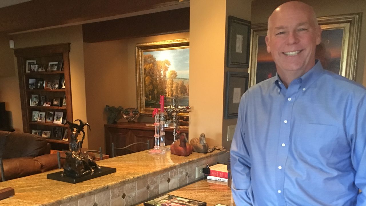 Greg Gianforte, the Republican candidate for Congress shows some old family photos of camping in the backcountry in his home in Bozeman.
