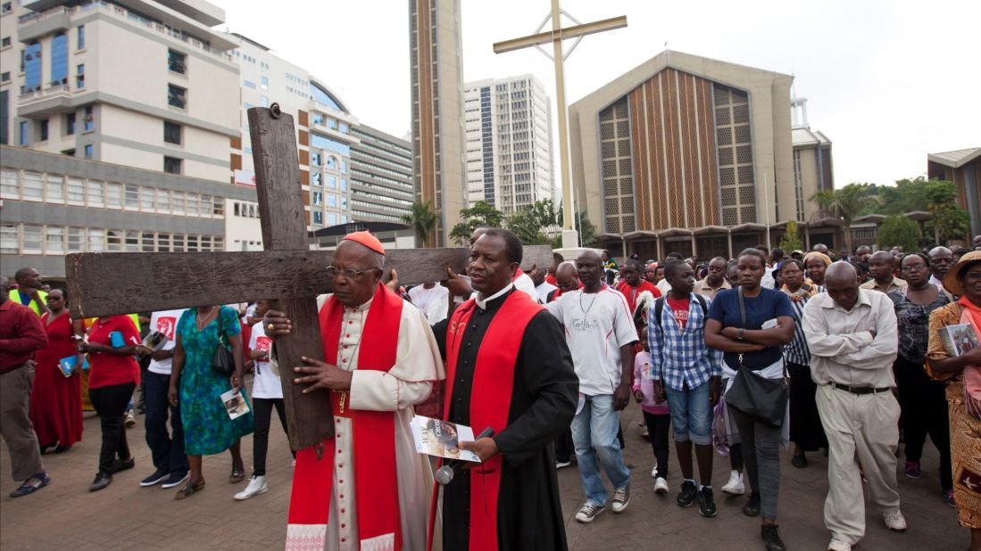 Cardinal John Njue, head of the Catholic Church in Kenya, carries a cross through the streets of Nairobi on April 14.