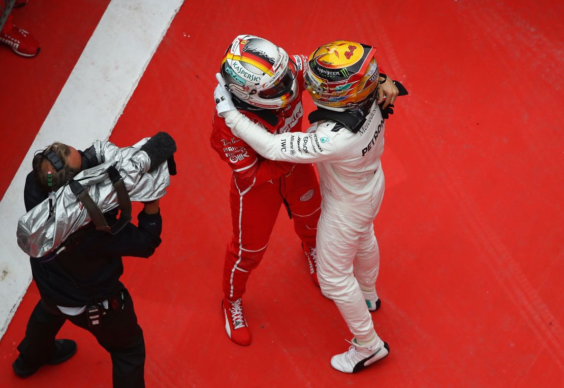 Sebastian Vettel (left) and Lewis Hamilton embrace at last weekend's Chinese Grand Prix.