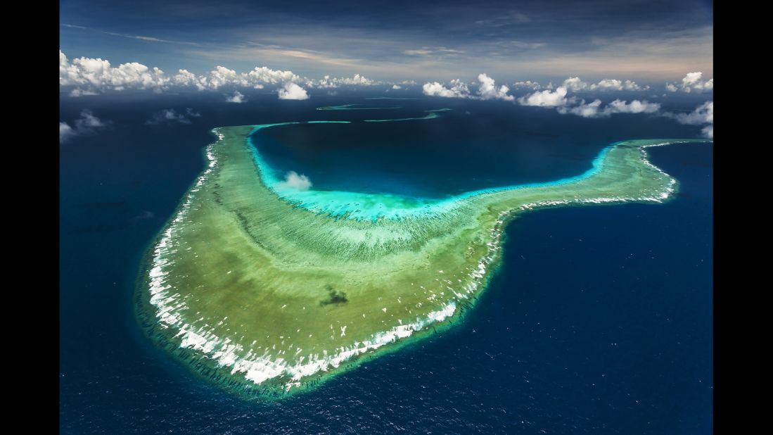 An aerial view of Great Detached Reef on the Northern Great Barrier Reef.  Great Detached Reef is a actually a number of reefs supported by a fossil mountain range. 