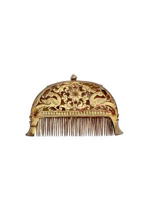 The collection also includes historic personal objects, such as this Kanghi comb from Rajasthan's Kota and Bundi regions. Carved with peacock and plant motifs, the hollowed, silver and gilt-gold piece doubled as a hair oil dispenser. (The comb was filled through the top screw-knob.) 