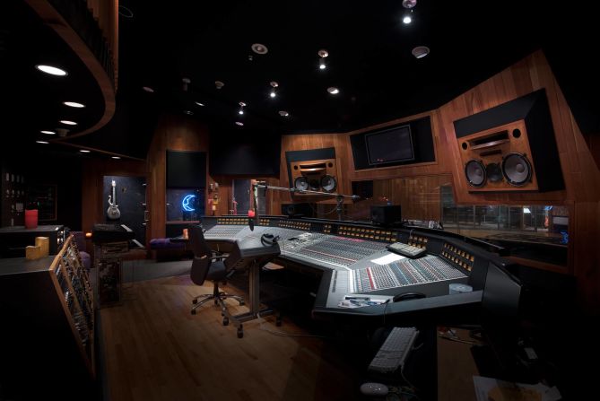 <strong>Studio A -- </strong>Studio A is where Prince recorded his last work. A microphone stand bends down towards his empty chair, with unfinished lyrics on the music stand. 