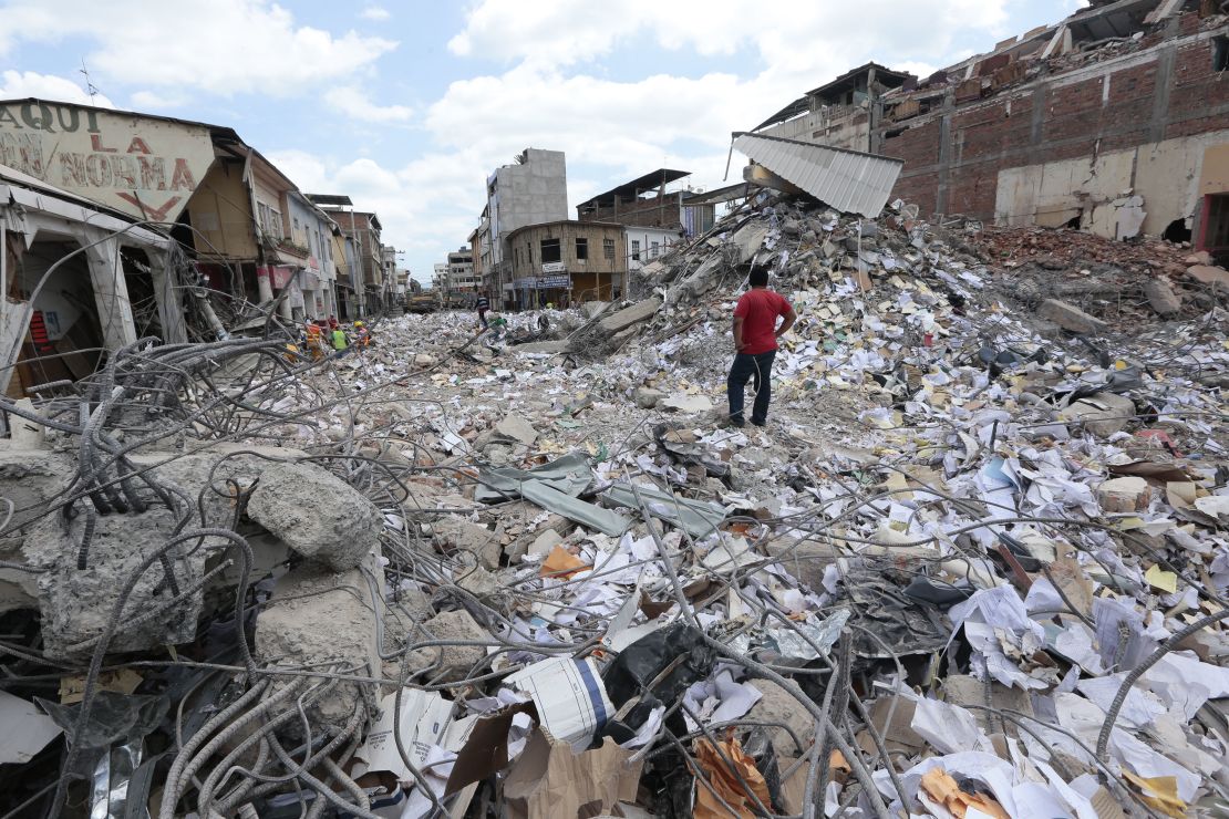 A man surveyes the rubble in Portoviejo, Ecuador, after a 2016 earthquake killed more than 650 people.