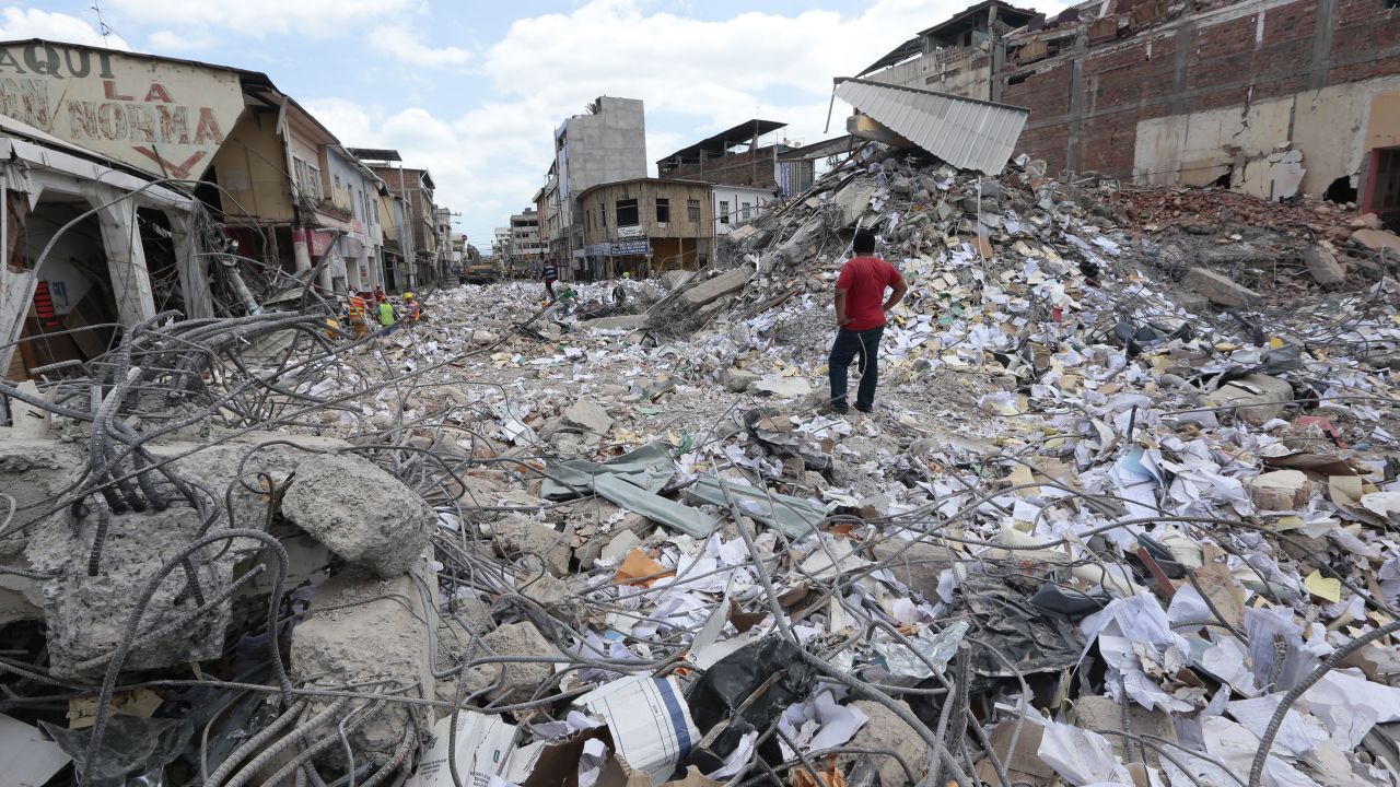 A man surveyes the rubble in Portoviejo, Ecuador, after a 2016 earthquake killed more than 650 people.
