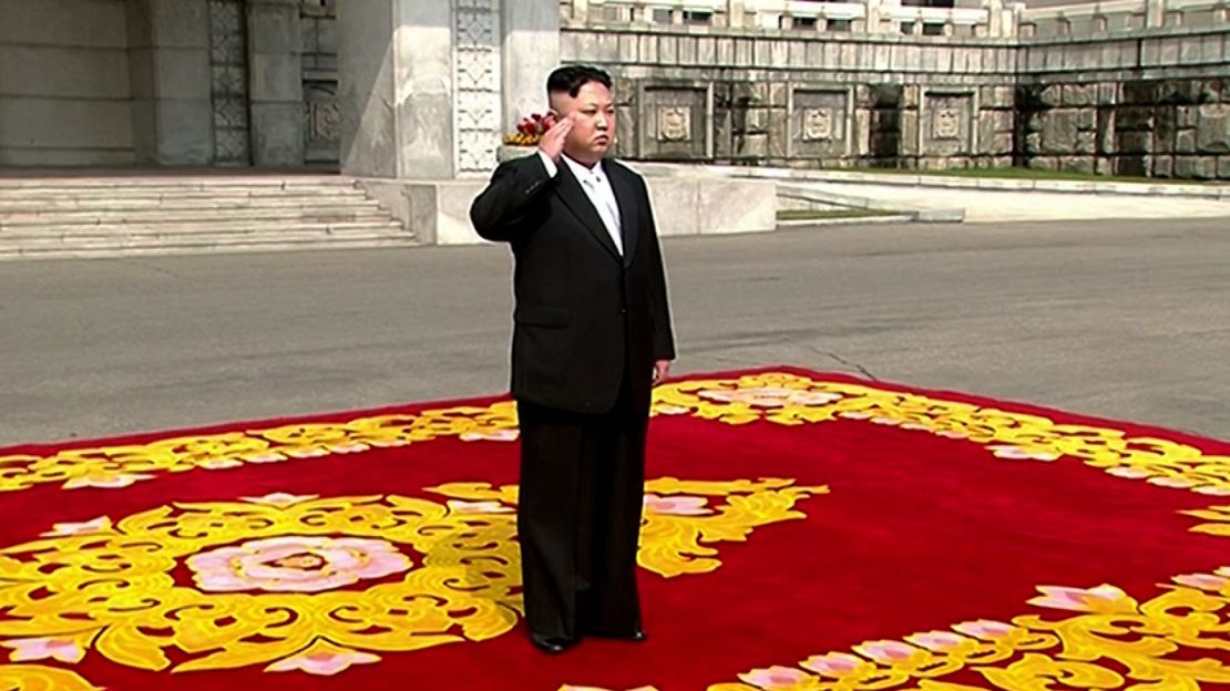 Kim Jong Un walks on the red carpet before the parade. 