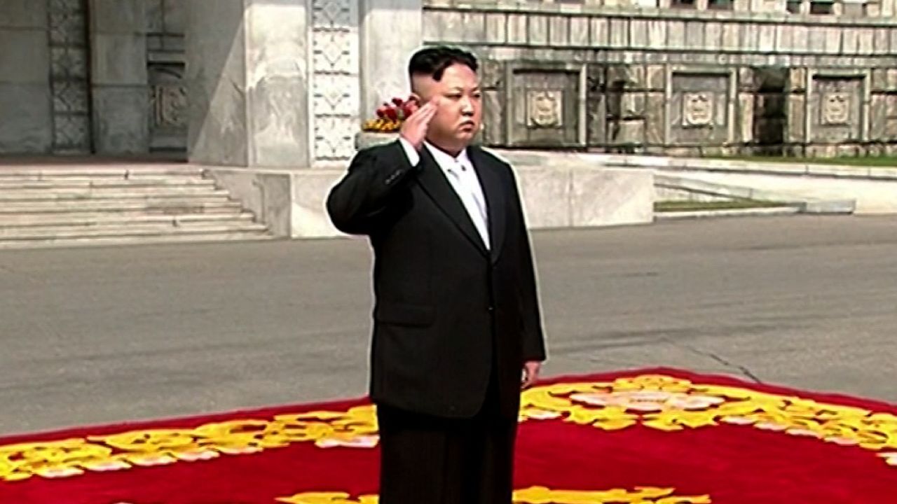 Kim Jong Un walks on the red carpet before the parade.