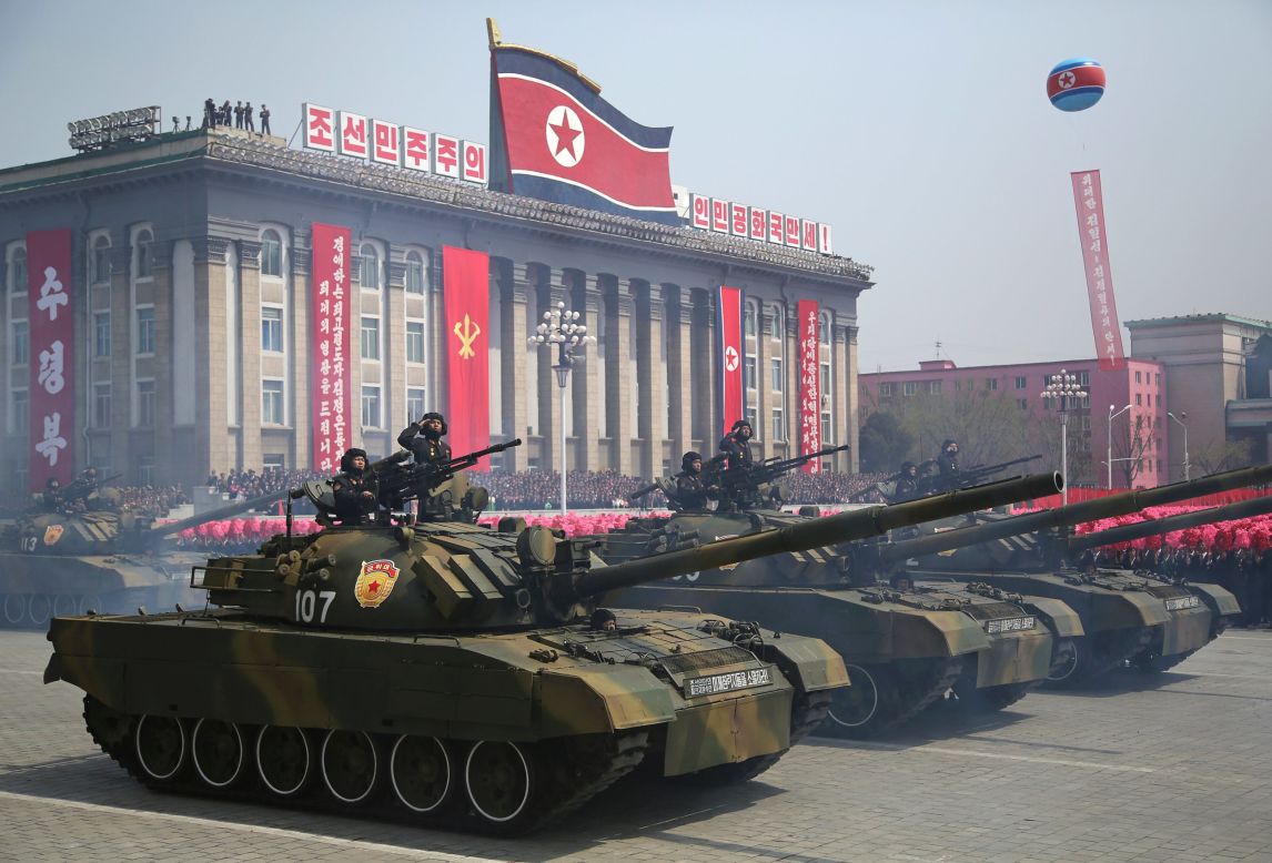 Soldiers in tanks take part in the military parade.