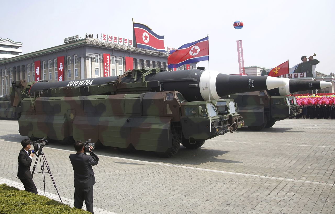 Missiles are paraded across Kim Il Sung Square.