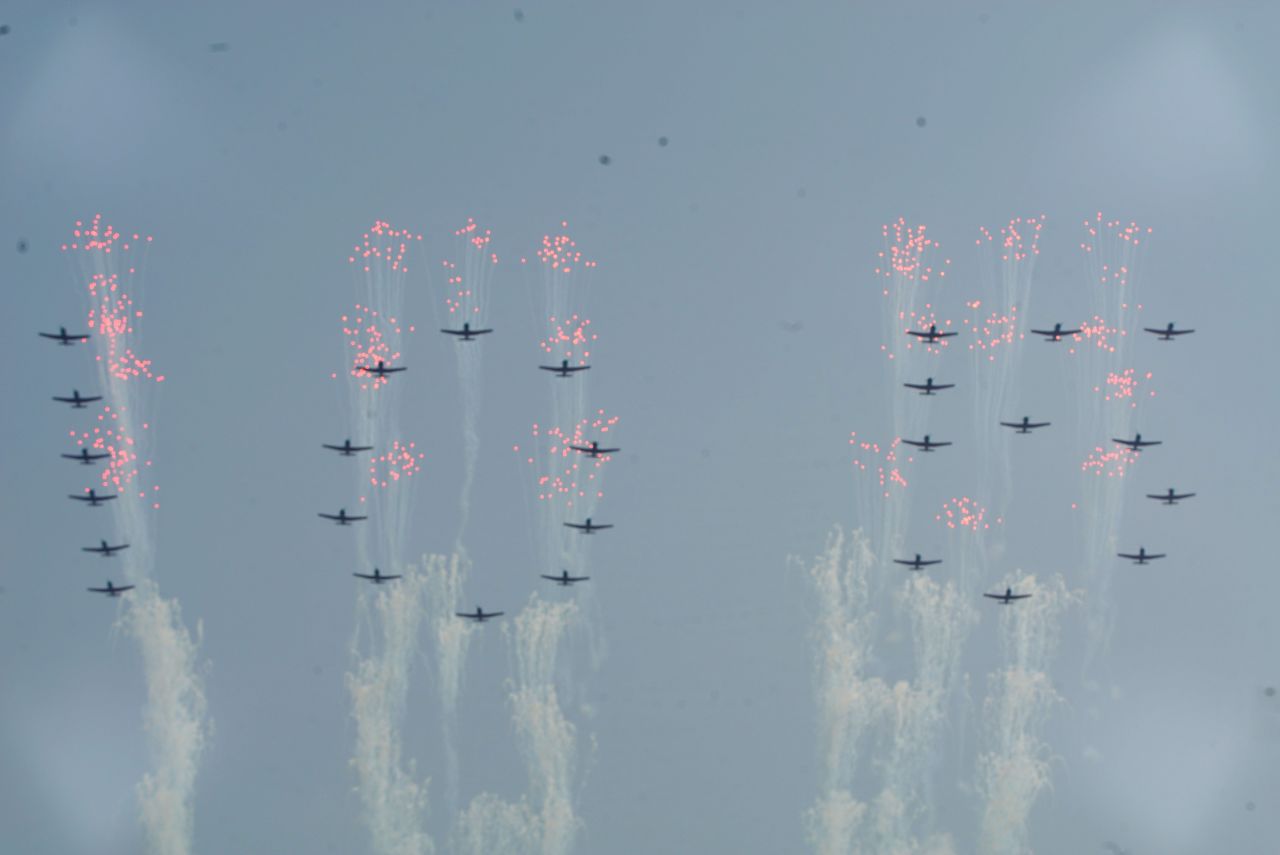 North Korean air force jets fly over the Pyongyang celebration.