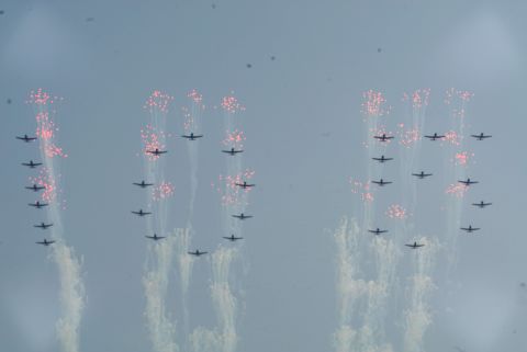 North Korean air force jets fly over the Pyongyang celebration.