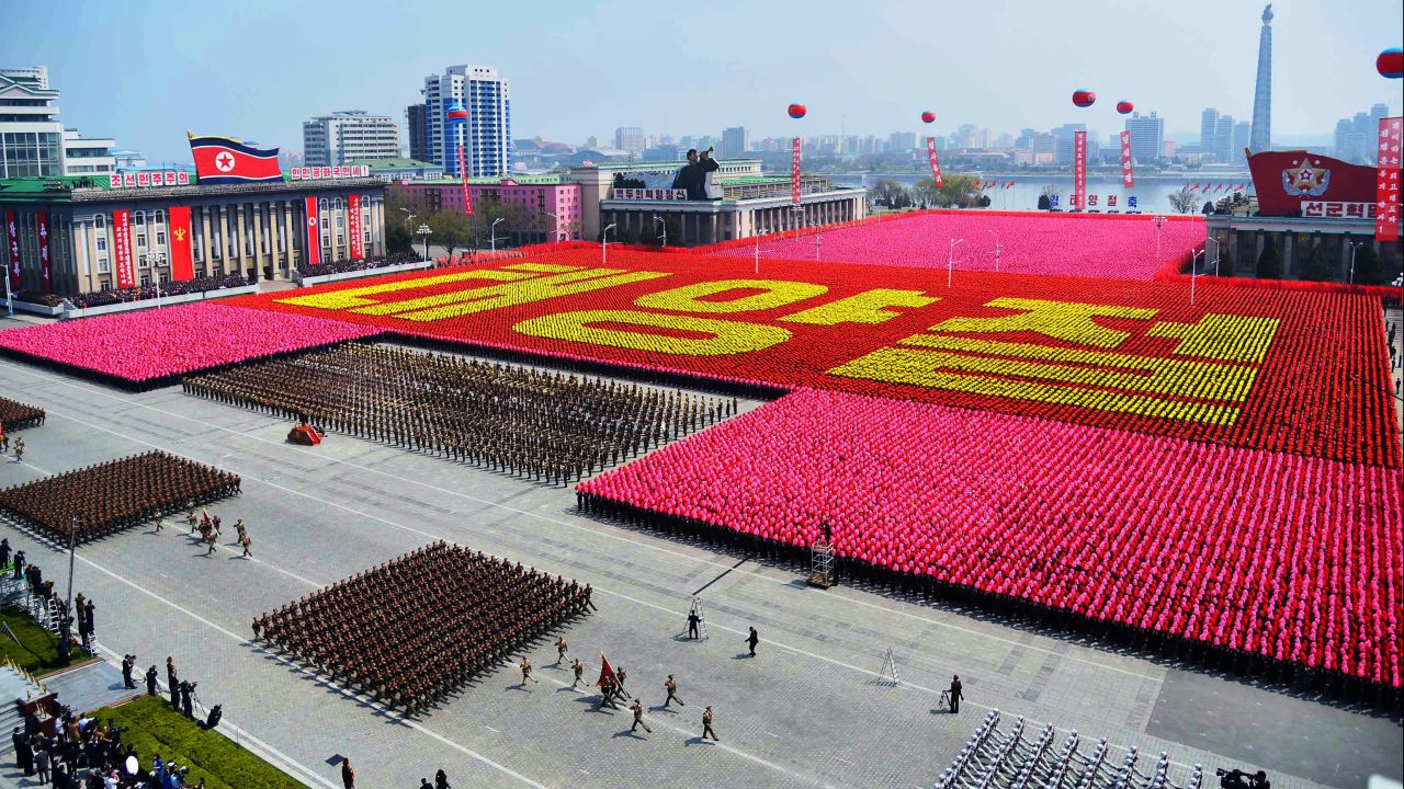 Korean citizens spell out "Day of the Sun" in Kim Il Sung Square.