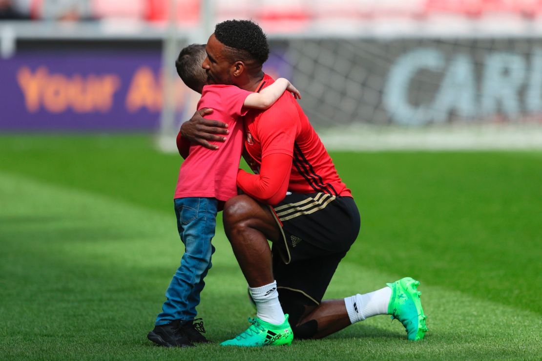 Defoe hugs Lowery ahead of Sunderland's game against Manchester United in April.