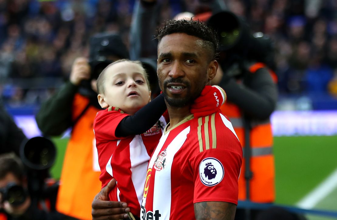 Lowery is carried out by Defoe prior to Sunderland's match against Everton at Goodison Park in Feburary.