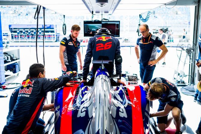 Daniil Kvyat steps into his Toro Rosso car ahead of practice in Bahrain.