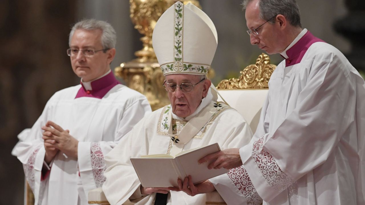 Pope Francis (C) leads the Easter Vigil at St Peter's basilica on April 15, 2017 in Vatican. Christians around the world are marking the Holy Week, commemorating the crucifixion of Jesus Christ, leading up to his resurrection on Easter. / AFP PHOTO / Tiziana FABI (Photo credit should read TIZIANA FABI/AFP/Getty Images)