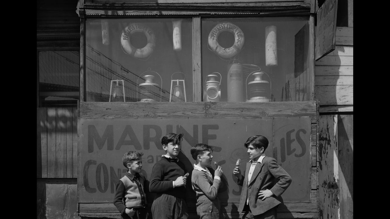 Boys stand near the Fulton Fish Market in 1946.