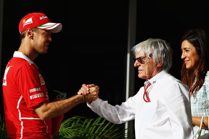 Sebastian Vettel greets former F1 boss Bernie Ecclestone ahead of Sunday's race in Bahrain. 