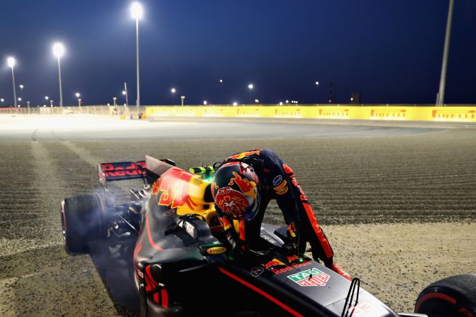 A dejected Max Verstappen steps out of his Red Bull Racing car after suffering brake failure in Sunday's race.